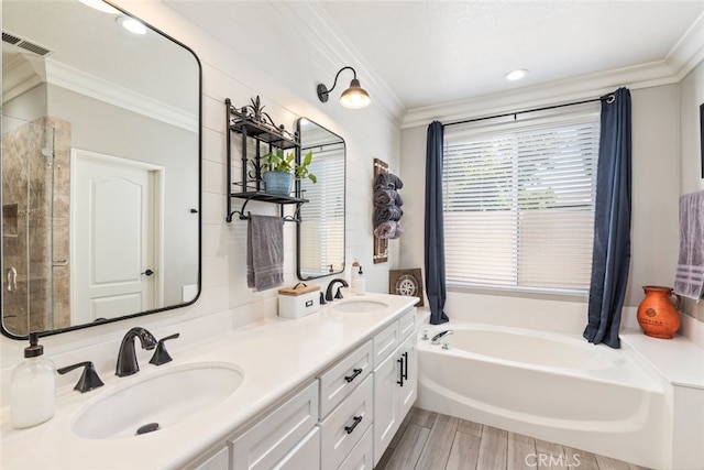 31735 Mesa View Dr, Menifee, CA 92584 - bathroom with ornamental molding, a bath, double vanity, a shower stall, and wood finished floors