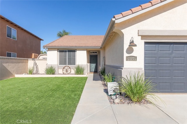 31735 Mesa View Dr, Menifee, CA 92584 - entrance to property featuring a tile roof, stucco siding, and a garage
