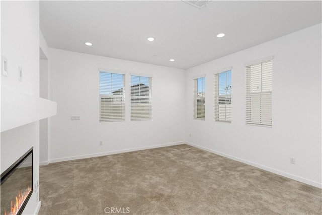 32813 Brunello Way, Temecula, CA 92591 - carpeted spare room with recessed lighting and a warm lit fireplace