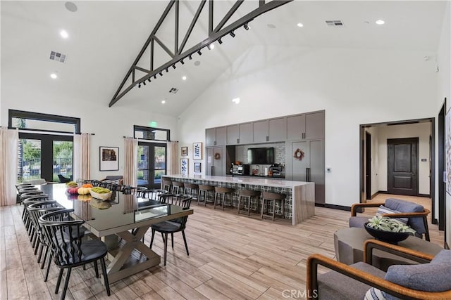 32813 Brunello Way, Temecula, CA 92591 - dining area featuring high vaulted ceiling, french doors, recessed lighting, and light wood finished floors