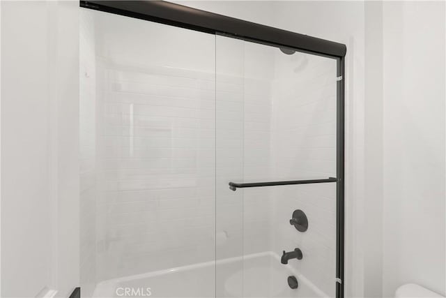 32813 Brunello Way, Temecula, CA 92591 - bathroom with shower / bath combination with glass door and toilet