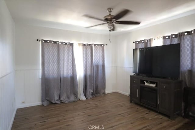 1004 Paloma St, Bakersfield, CA 93304 - unfurnished living room with ceiling fan, wood finished floors, and a wainscoted wall