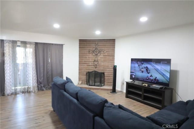 1004 Paloma St, Bakersfield, CA 93304 - living room featuring a fireplace, wood finished floors, and recessed lighting
