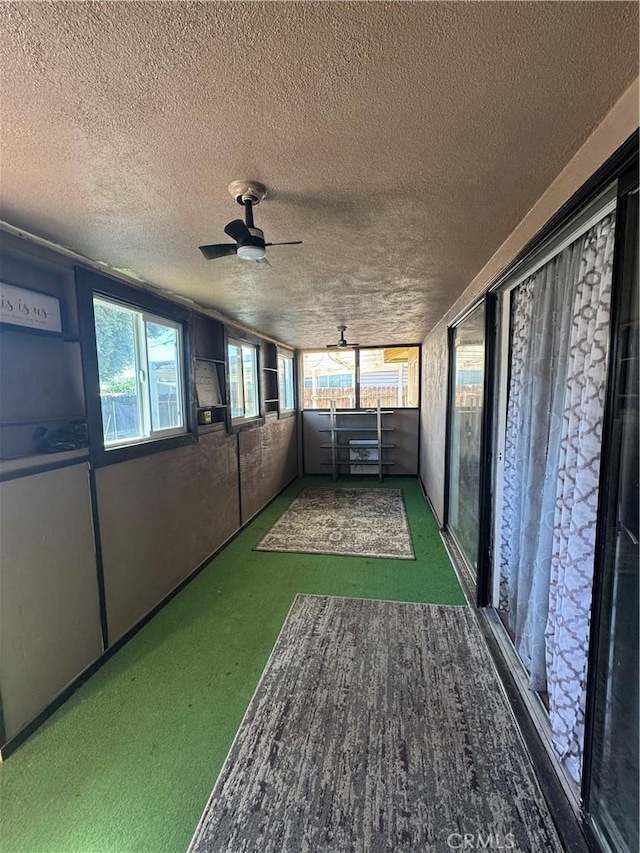 1004 Paloma St, Bakersfield, CA 93304 - unfurnished sunroom featuring a ceiling fan and plenty of natural light