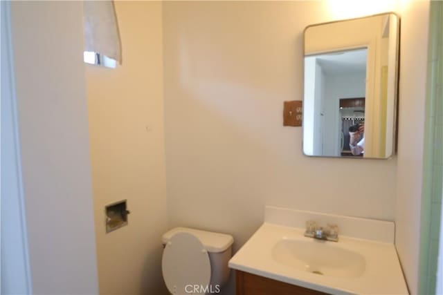 1004 Paloma St, Bakersfield, CA 93304 - bathroom featuring vanity and toilet