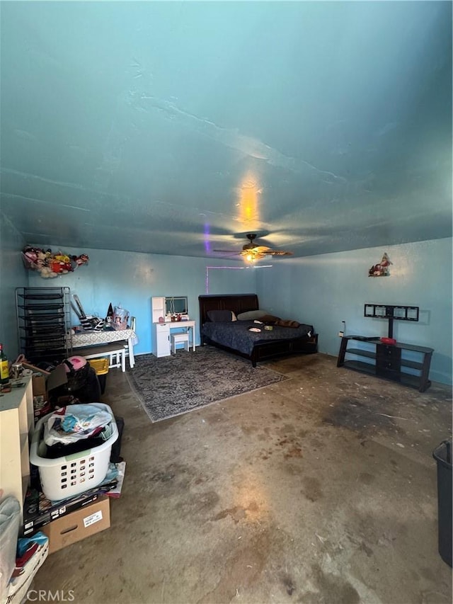 1004 Paloma St, Bakersfield, CA 93304 - bedroom featuring concrete flooring and a ceiling fan
