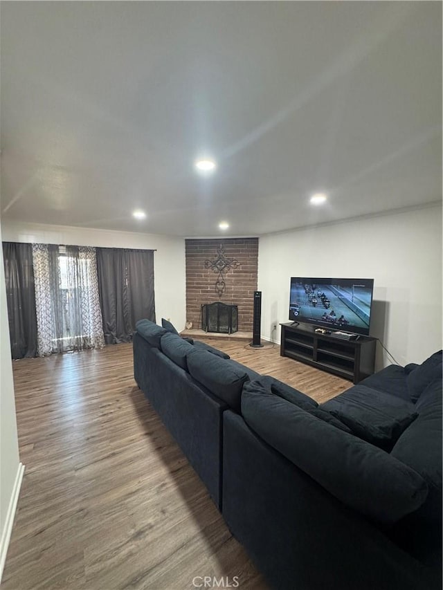 1004 Paloma St, Bakersfield, CA 93304 - living area with wood finished floors, a fireplace, and recessed lighting