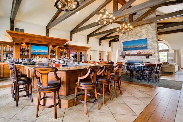 5371 Punta Alta Unit 2G, Laguna Woods, CA 92637 - indoor wet bar featuring beamed ceiling, high vaulted ceiling, a chandelier, and recessed lighting
