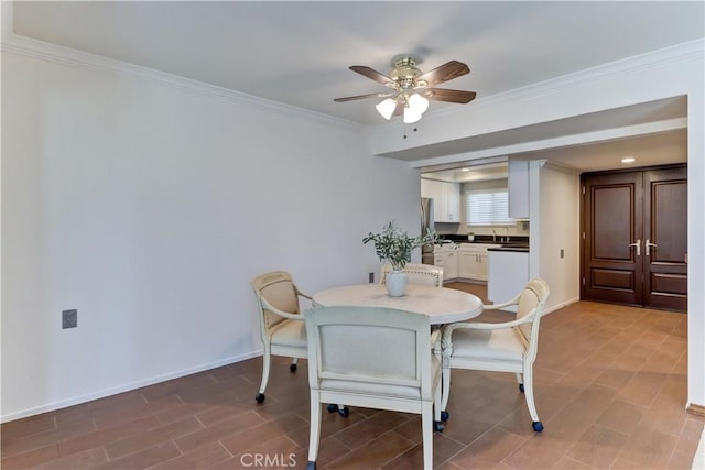 5371 Punta Alta Unit 2G, Laguna Woods, CA 92637 - dining space with ceiling fan and ornamental molding