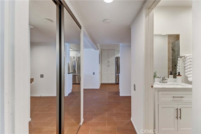 5371 Punta Alta Unit 2G, Laguna Woods, CA 92637 - hall with a sink and baseboards