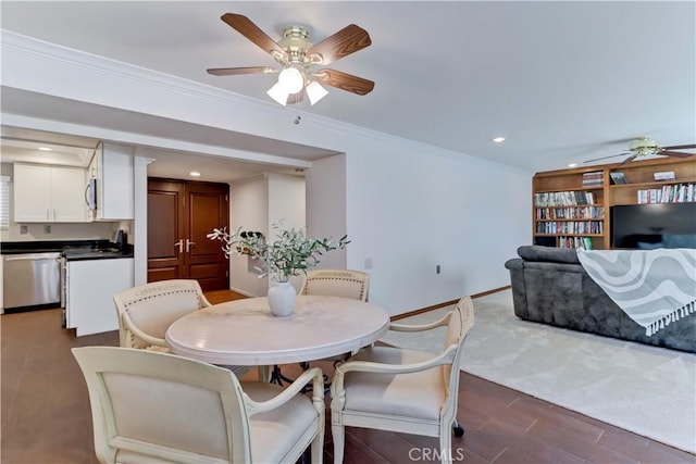 5371 Punta Alta Unit 2G, Laguna Woods, CA 92637 - dining space with ceiling fan, dark wood-style flooring, ornamental molding, and recessed lighting