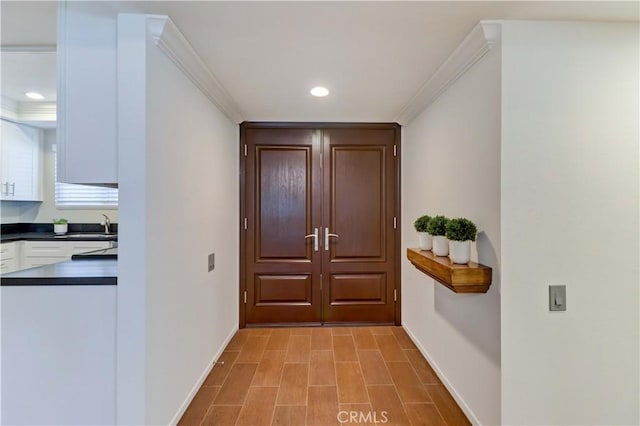 5371 Punta Alta Unit 2G, Laguna Woods, CA 92637 - doorway with recessed lighting and crown molding