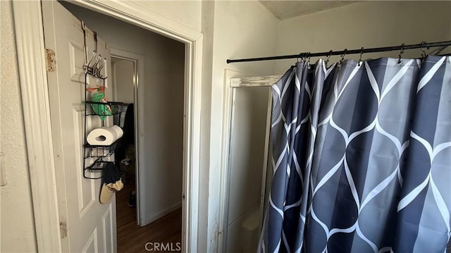 10218 Virginia Ave, South Gate, CA 90280 - full bathroom with wood finished floors and a shower with shower curtain