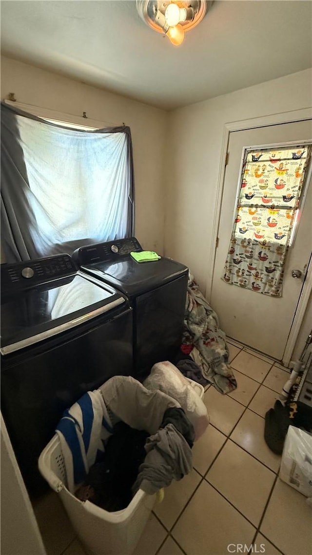 10218 Virginia Ave, South Gate, CA 90280 - laundry room featuring washer and clothes dryer and tile patterned floors