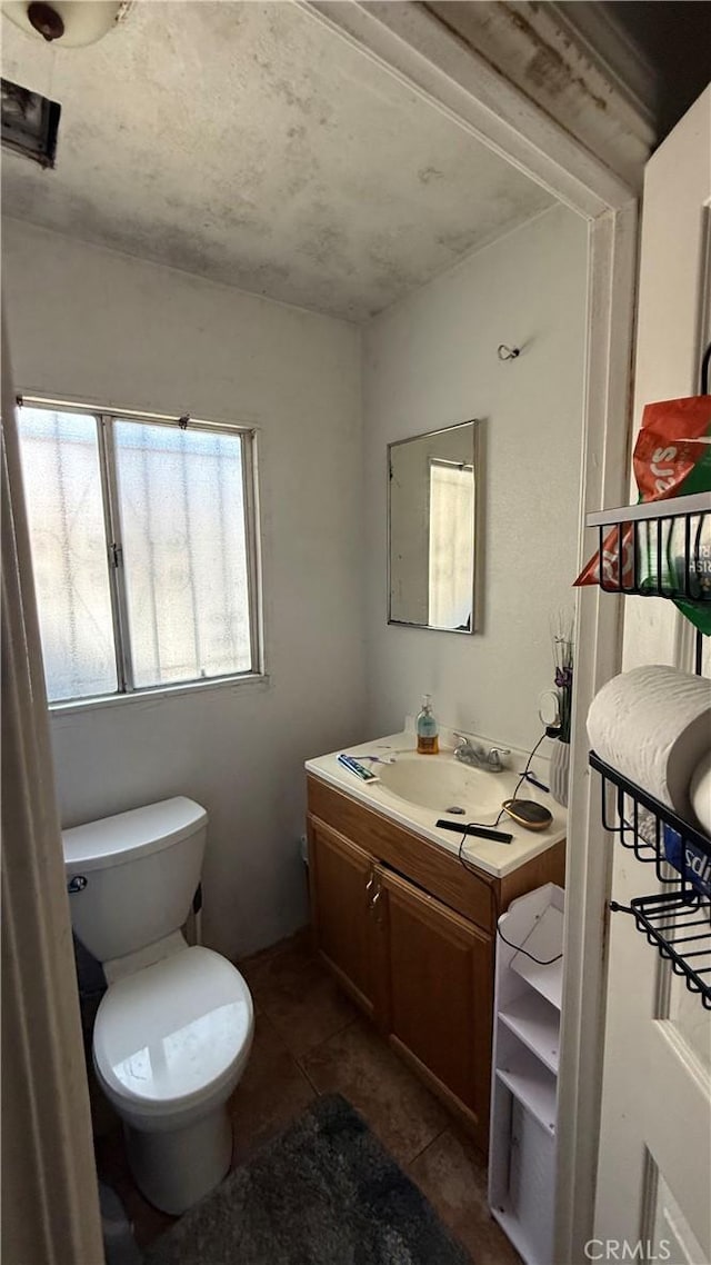 10218 Virginia Ave, South Gate, CA 90280 - half bath featuring vanity and tile patterned flooring