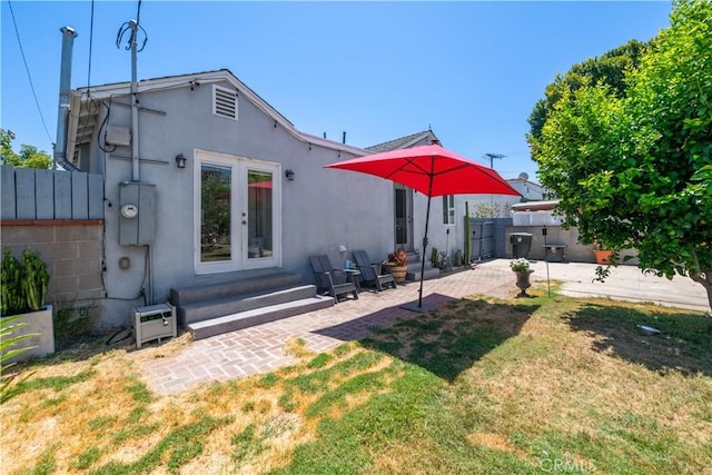 321 N Keystone St, Burbank, CA 91506 - back of property with french doors, stucco siding, and a patio