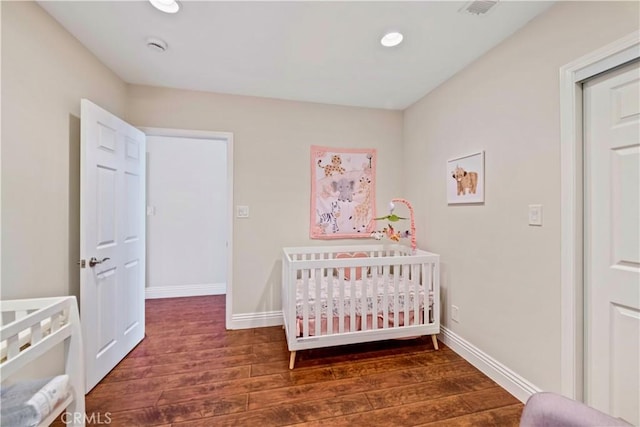 321 N Keystone St, Burbank, CA 91506 - bedroom with wood finished floors, a nursery area, and recessed lighting