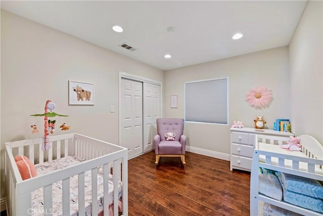 321 N Keystone St, Burbank, CA 91506 - bedroom featuring dark wood-style flooring, a closet, recessed lighting, and a crib