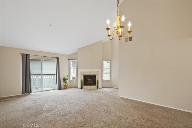 10361 Garden Grove Blvd Unit 17, Garden Grove, CA 92843 - unfurnished living room featuring a chandelier, carpet flooring, high vaulted ceiling, and a fireplace