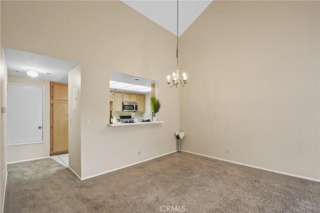 10361 Garden Grove Blvd Unit 17, Garden Grove, CA 92843 - unfurnished living room with carpet floors, a chandelier, and a high ceiling