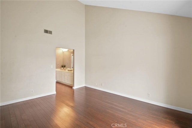 10361 Garden Grove Blvd Unit 17, Garden Grove, CA 92843 - empty room with dark wood finished floors and high vaulted ceiling