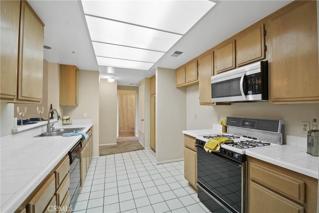 10361 Garden Grove Blvd Unit 17, Garden Grove, CA 92843 - kitchen featuring stainless steel microwave, gas stove, tile countertops, and dishwasher