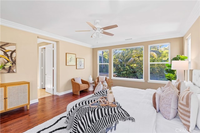 27684 Manor Hill Rd, Laguna Niguel, CA 92677 - bedroom featuring multiple windows, wood finished floors, ornamental molding, and ceiling fan