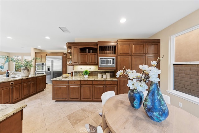 27684 Manor Hill Rd, Laguna Niguel, CA 92677 - kitchen with built in appliances, open shelves, decorative backsplash, light stone countertops, and recessed lighting