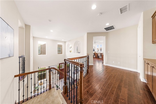 27684 Manor Hill Rd, Laguna Niguel, CA 92677 - hall with an upstairs landing, dark wood finished floors, healthy amount of natural light, and recessed lighting