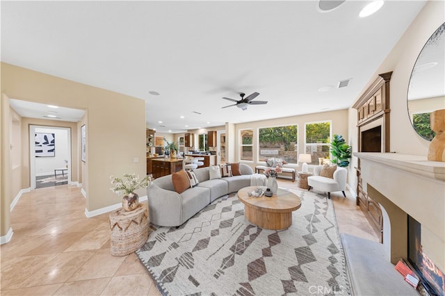 27684 Manor Hill Rd, Laguna Niguel, CA 92677 - living area featuring a high end fireplace, ceiling fan, light tile patterned flooring, and recessed lighting