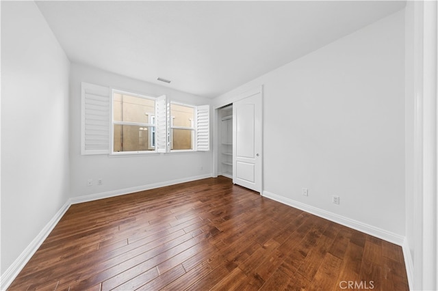 27684 Manor Hill Rd, Laguna Niguel, CA 92677 - unfurnished bedroom featuring dark wood-style flooring and a closet