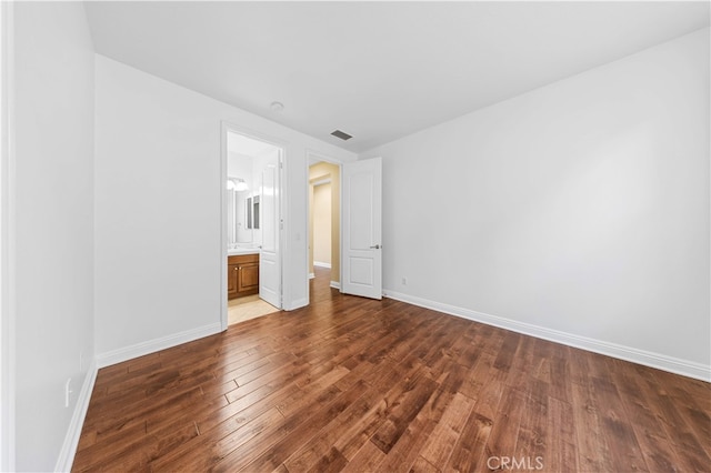 27684 Manor Hill Rd, Laguna Niguel, CA 92677 - unfurnished bedroom with wood finished floors and ensuite bath