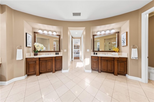 27684 Manor Hill Rd, Laguna Niguel, CA 92677 - ensuite bathroom with vanity, tile patterned flooring, and walk in shower