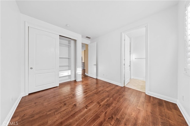27684 Manor Hill Rd, Laguna Niguel, CA 92677 - unfurnished bedroom with wood finished floors and a closet
