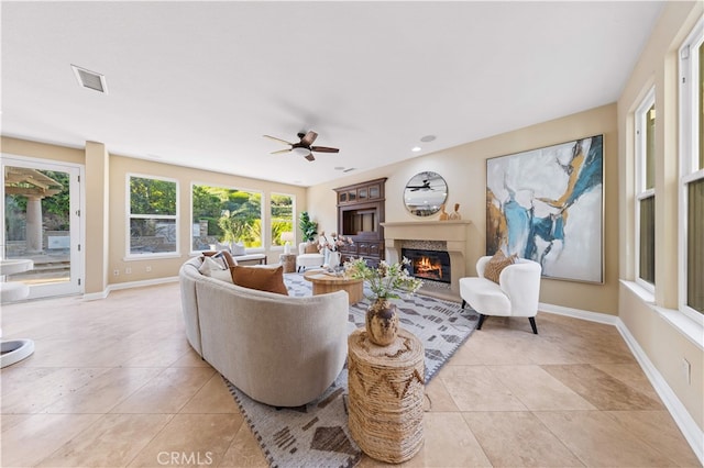 27684 Manor Hill Rd, Laguna Niguel, CA 92677 - living area with a lit fireplace, light tile patterned floors, a ceiling fan, and recessed lighting