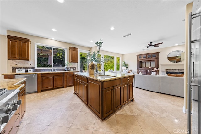 27684 Manor Hill Rd, Laguna Niguel, CA 92677 - kitchen with stainless steel dishwasher, a ceiling fan, light stone countertops, stovetop, and recessed lighting