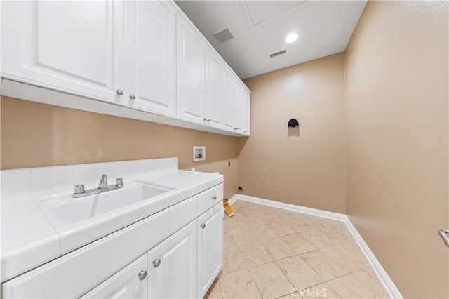 27684 Manor Hill Rd, Laguna Niguel, CA 92677 - laundry area featuring washer hookup, cabinet space, electric dryer hookup, light tile patterned floors, and recessed lighting