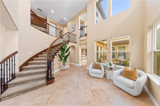 27684 Manor Hill Rd, Laguna Niguel, CA 92677 - tiled entryway with a towering ceiling, stairs, and arched walkways
