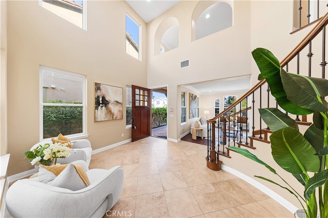 27684 Manor Hill Rd, Laguna Niguel, CA 92677 - entryway featuring stairs, a high ceiling, and light tile patterned floors