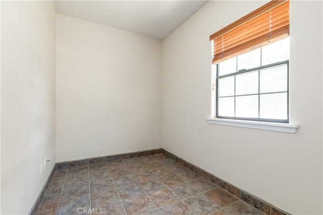 2911 Gilead Ln, Paso Robles, CA 93446 - empty room with baseboards and dark stone finish floors