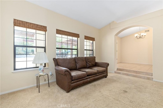 2911 Gilead Ln, Paso Robles, CA 93446 - carpeted living area featuring arched walkways, a chandelier, and healthy amount of natural light