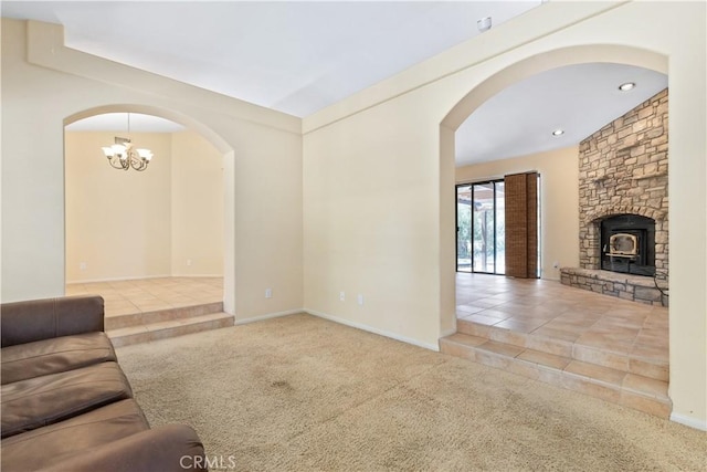2911 Gilead Ln, Paso Robles, CA 93446 - unfurnished living room featuring tile patterned flooring, arched walkways, carpet flooring, a chandelier, and recessed lighting