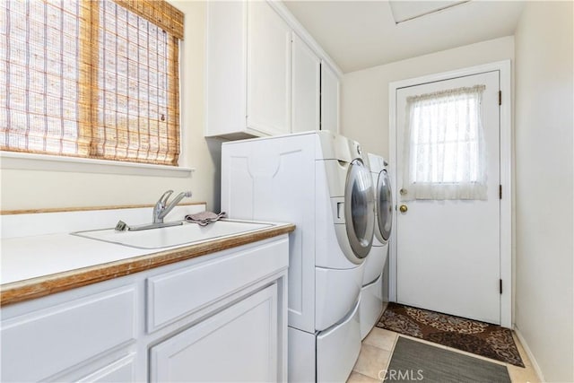 2911 Gilead Ln, Paso Robles, CA 93446 - washroom featuring washer and clothes dryer, cabinet space, and light tile patterned floors
