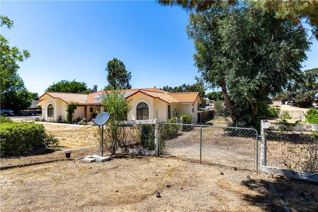 2911 Gilead Ln, Paso Robles, CA 93446 - mediterranean / spanish-style house with a gate, a tile roof, and stucco siding