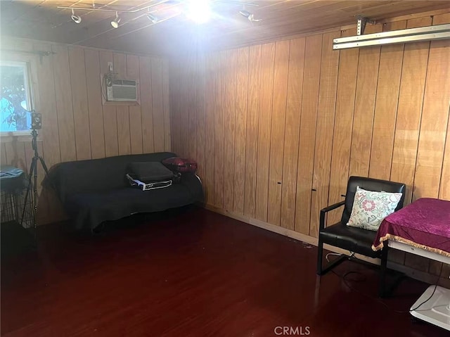 934 W 12th St, Pomona, CA 91766 - sitting room with wood finished floors, wooden walls, and an AC wall unit