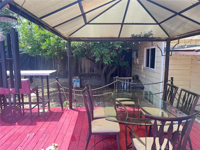934 W 12th St, Pomona, CA 91766 - wooden deck featuring a gazebo and outdoor dining area