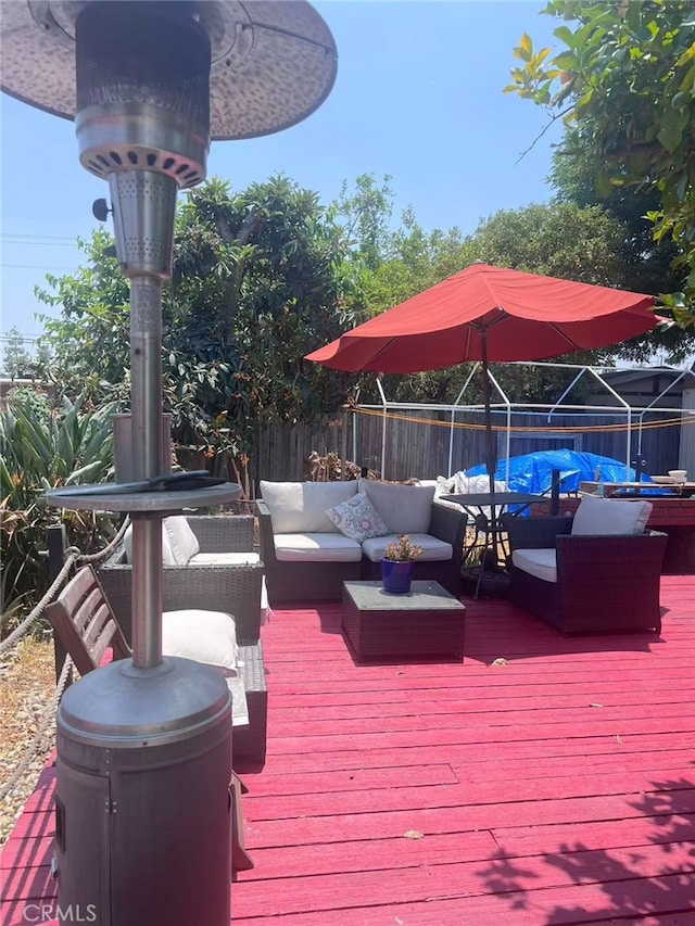 934 W 12th St, Pomona, CA 91766 - deck with a fenced backyard and outdoor lounge area