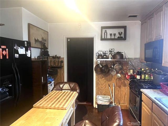934 W 12th St, Pomona, CA 91766 - kitchen featuring black appliances, butcher block counters, and dark wood-style floors