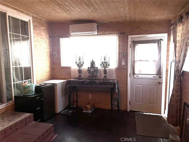 934 W 12th St, Pomona, CA 91766 - foyer entrance featuring a wall unit AC, wooden ceiling, and dark wood finished floors
