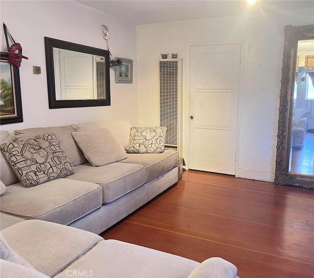 934 W 12th St, Pomona, CA 91766 - living area featuring a heating unit and wood finished floors